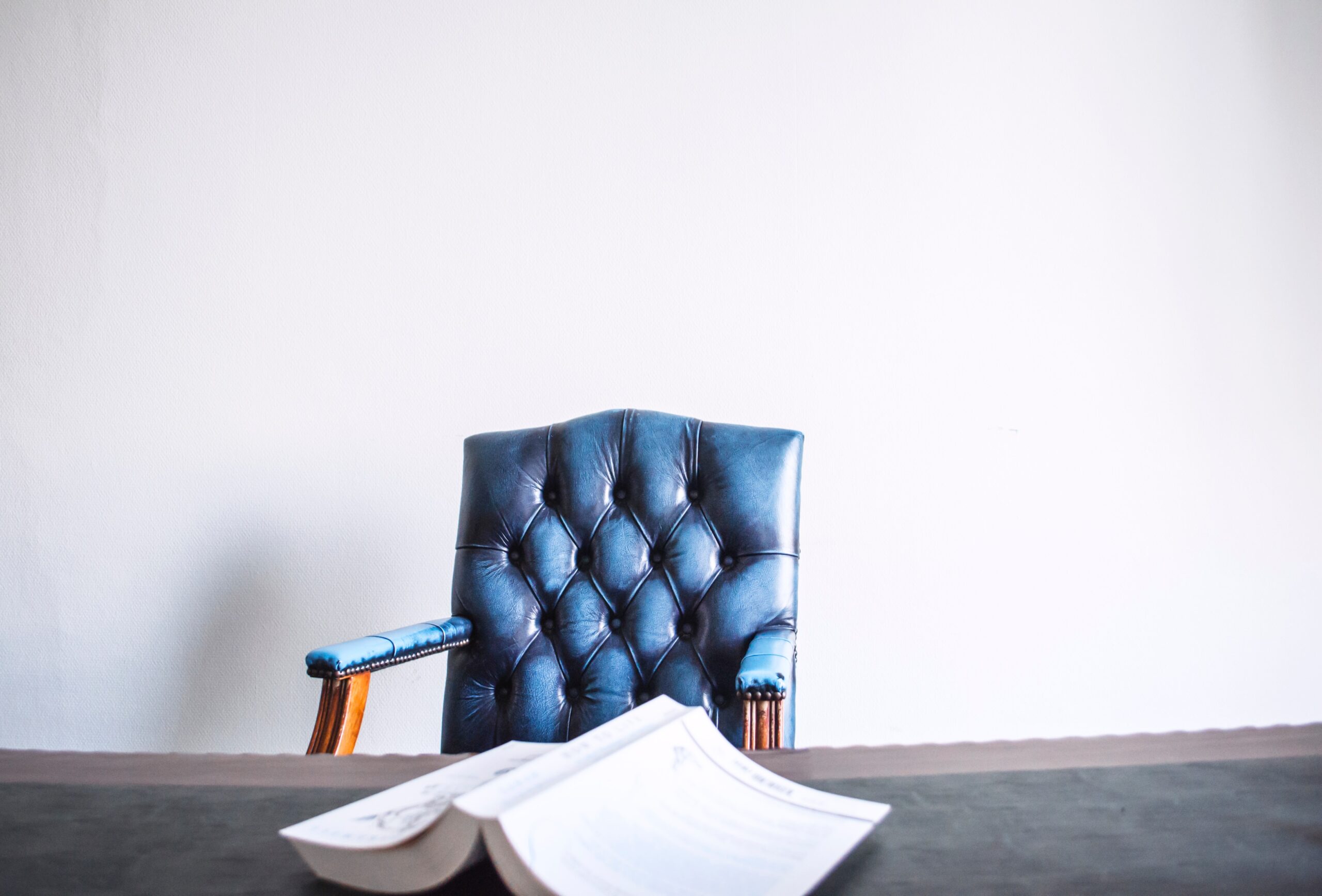 empty chair behind a book on a chair