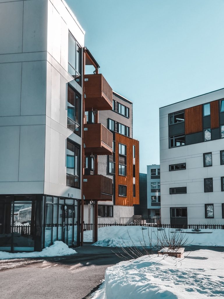 Modern apartment buildings against blue sky